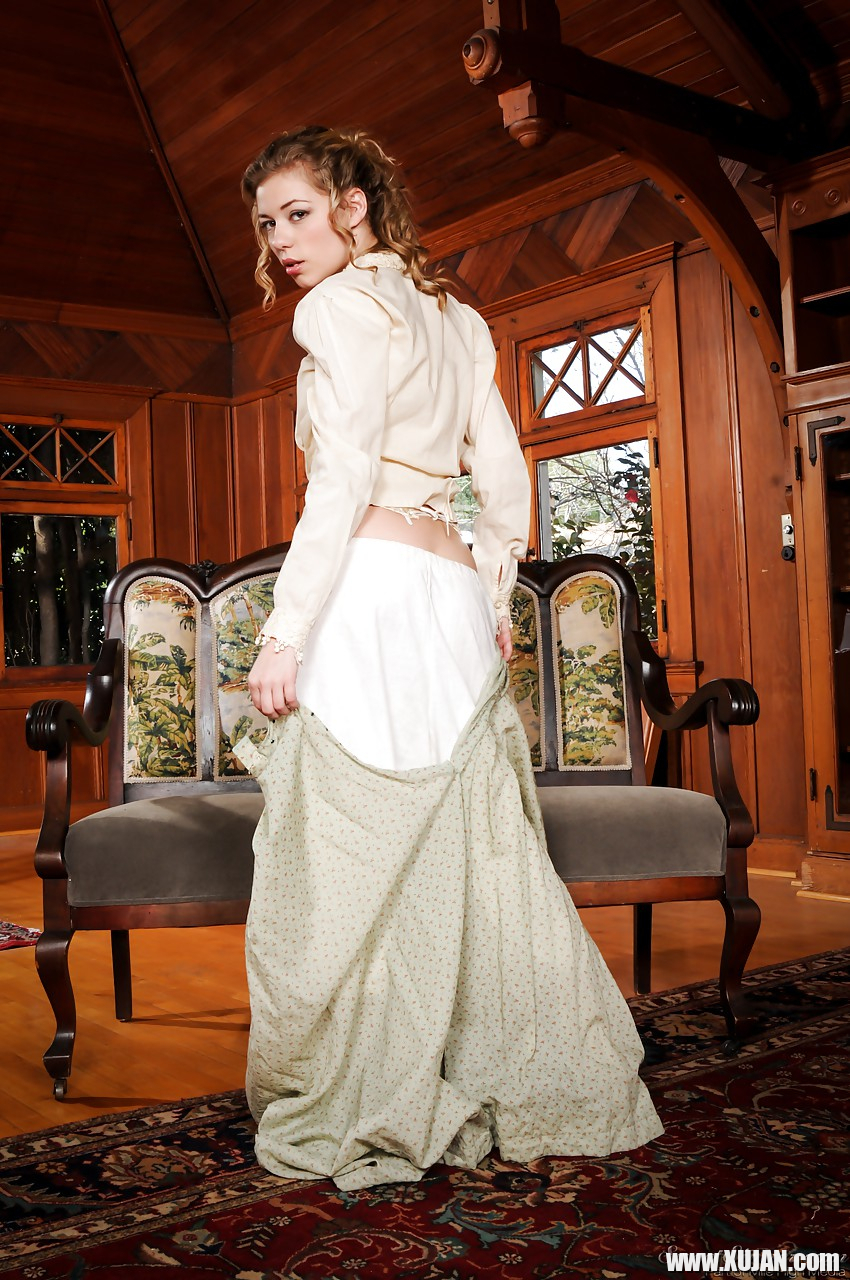 Pornstar Nicole Ray strips off retro clothes to model nude in granny boots - Photo #1570048