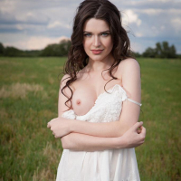 Serena Wood bares her sexy body outside in the grass