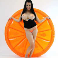 Kayla Kiss strips for you on her big orange inflatable