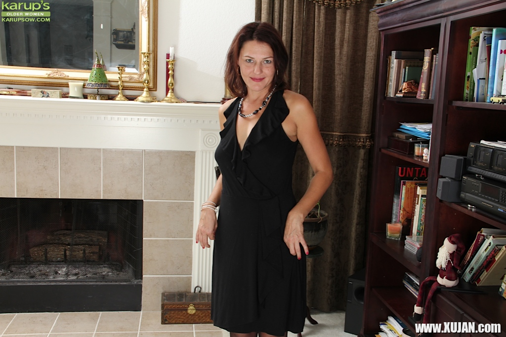 Milf babe Ava Austin is posing in her sexy black dress on camera - Photo #1591274