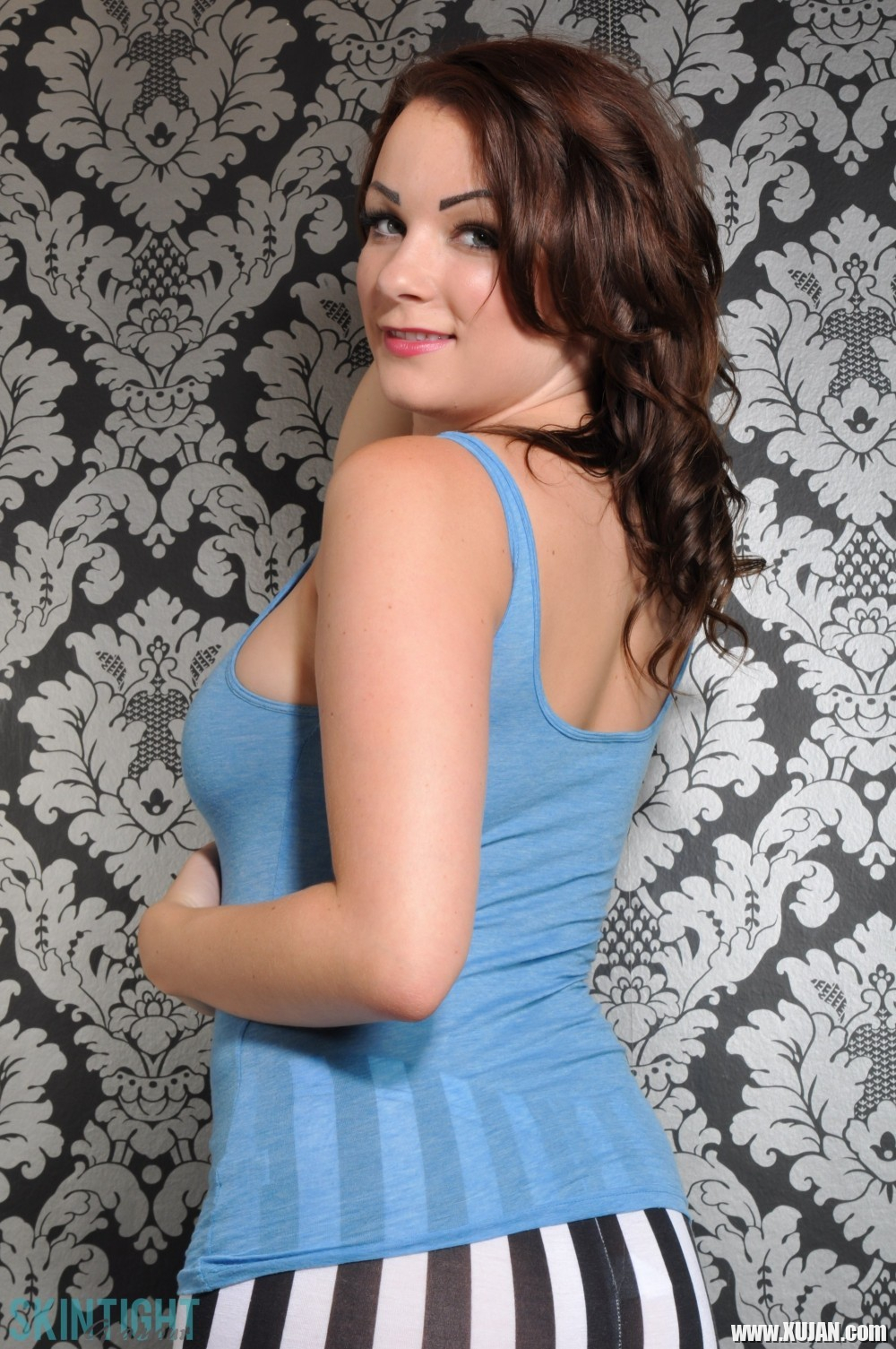 Beauty brunette Penny in her stripe leggings and blue top - Photo #1595990
