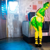 Kinky cosplay chick Tiffany Doll posing in body paint uniform and spreading