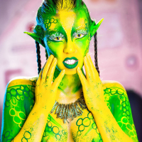 Kinky cosplay chick Tiffany Doll posing in body paint uniform and spreading
