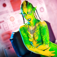Kinky cosplay chick Tiffany Doll posing in body paint uniform and spreading