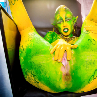 Kinky cosplay chick Tiffany Doll posing in body paint uniform and spreading