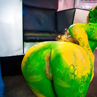 Kinky cosplay chick Tiffany Doll posing in body paint uniform and spreading