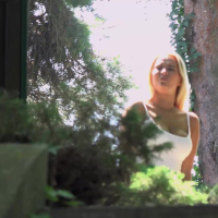 Nikky Dream in short green skirt taking a break