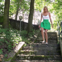 Nikky Dream in short green skirt taking a break