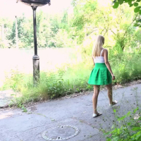 Nikky Dream in short green skirt taking a break