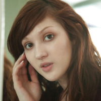 Cute redhead amateur Ellena Woods spreading her legs on her bed