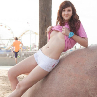 Redhead teen Ellena Woods teases with her hot body outside