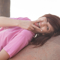 Redhead coed Ellena Woods invites you to have some fun with her on the beach