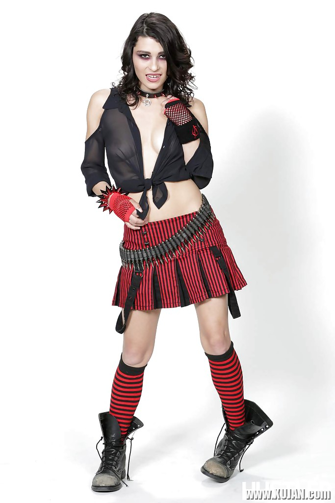 Outstanding brunette Raven Rockette is posing in her red skirt - Photo #1615832