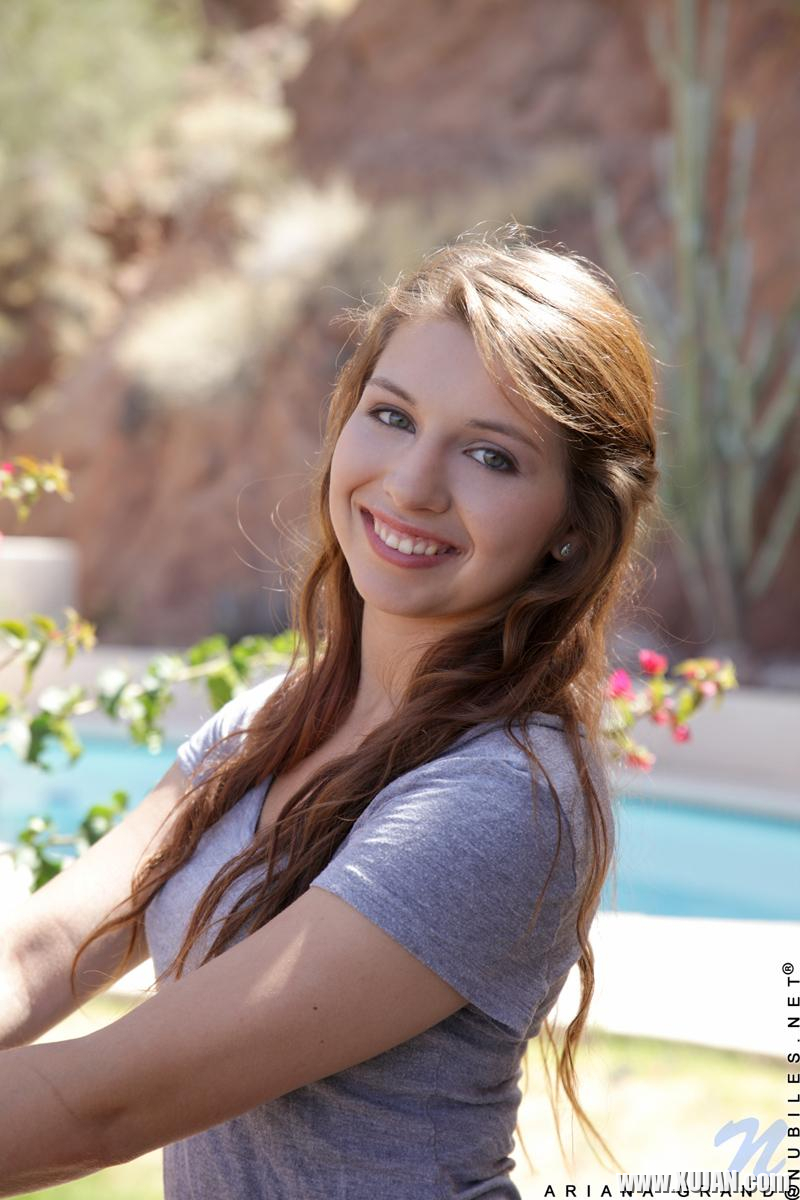 Fresh faced brunette Ariana Grand fondles her shaved pussy by the pool - Photo #1621068