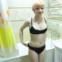 Taking some pictures of my redhead wife showering