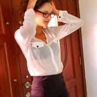 Glasses wearing babe Sade Mare spreading shaved pussy for glamour pictures