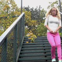 Amy Pink in tight pink pants taking a leak