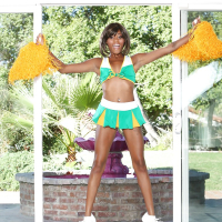 Black cheerleader Karma May shows off her big dark ass and tits