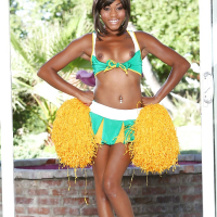 Black cheerleader Karma May shows off her big dark ass and tits