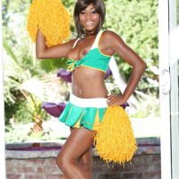 Black cheerleader Karma May shows off her big dark ass and tits