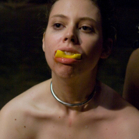 Maitresse Madeline storms into the green room grabs Kristine and parades her ar