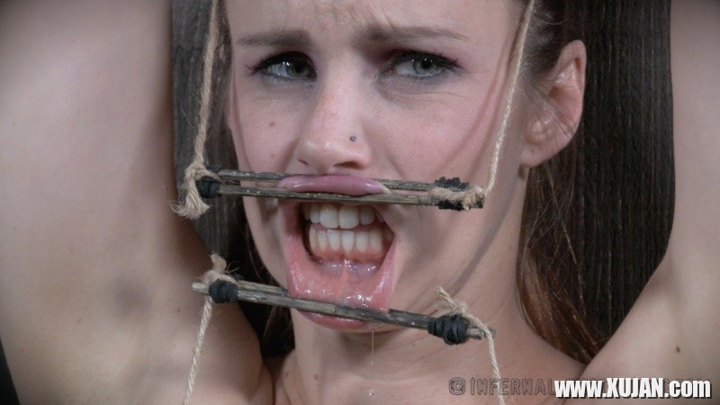 Bella Rossi is bound in wood with mouth spreader with clamps on her big tits - Photo #1655243