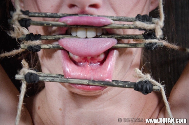 Bella Rossi is bound in wood with mouth spreader with clamps on her big tits - Photo #1655247