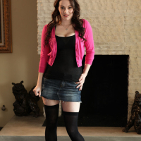 Smiley babe in miniskirt revealing her ample bosoms and trimmed pussy