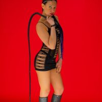 Kinky hottie Ashley Grey playing with a big whip while posing