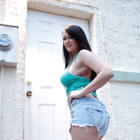 Saucy babe with nice ass Alexis Grace revealing her big tits outdoor