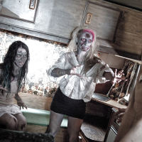 Fetish models Brittany Lynn and Jessie Lee giving head in Zombie threesome