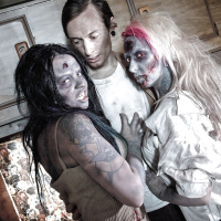 Fetish models Brittany Lynn and Jessie Lee giving head in Zombie threesome