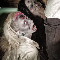 Fetish models Brittany Lynn and Jessie Lee giving head in Zombie threesome