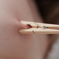 Kinky Ginger Mary plays with laundry pegs