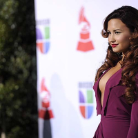 Demi Lovato exposing sexy body and huge cleavage in nice red dress