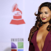 Demi Lovato exposing sexy body and huge cleavage in nice red dress