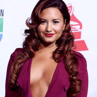 Demi Lovato exposing sexy body and huge cleavage in nice red dress
