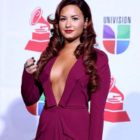 Demi Lovato exposing sexy body and huge cleavage in nice red dress