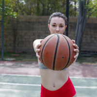Cute coed Alexis Rodriguez stripping and spreading on public bb court