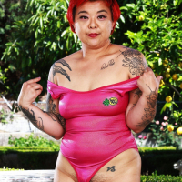 Redhead asian lady Lulu Sparkle reveals her naked hairy pussy