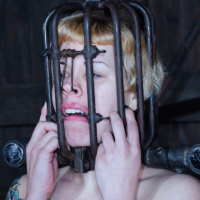 Elizabeth Thorn is dungeon bound in leather with girlfriend Deli