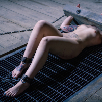 Elizabeth Thorn is dungeon bound in leather with girlfriend Deli