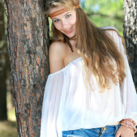 European Genevieve Gandi in woods stripping to bare perky tits nice ass