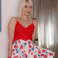 Cute blonde Miss Melissa strips to only red heels