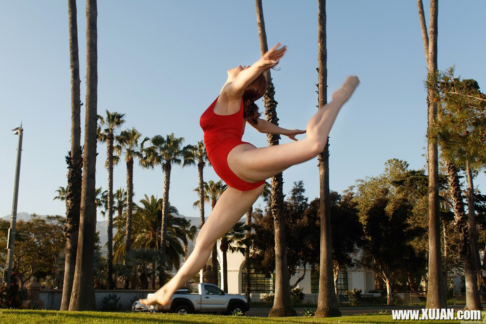 Kayla Coyote performs gymnastics in a red bodysuit - Photo #1751605