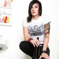 Slim and inked Stunner Nikki Hearts strips down