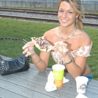Sensual blonde Shelby Bell posing outdoors in blue jeans