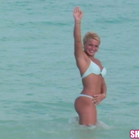 Blonde beach girl Shelby Bell masturbating with a blue dildo