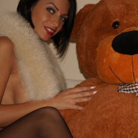 Busty Gal Anisyia XXX posing with her Teddy Bear