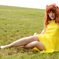 Amarna Miller poses in a beautiful yellow dress while outside